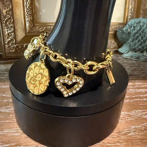 Coach Gold Tone Multi Charm Bracelet. Includes locket Heart, Bird, Star and more - Picture 17 of 17